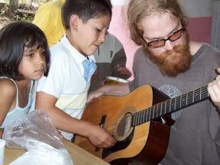 Josh playing music with the kids of San Isidro Pictures, Images and Photos